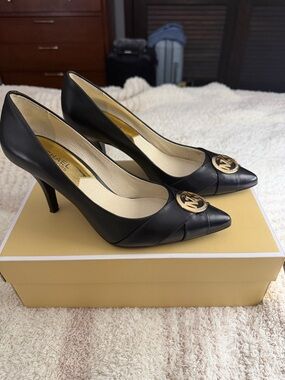 Michael Kors Black Leather Pointed Toe Heels with Gold MK Medallion